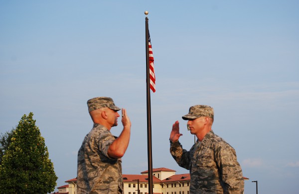 Cadre member Matthew McWhirter reaffirms his oath of office upon promotion to captain, summer 2011.